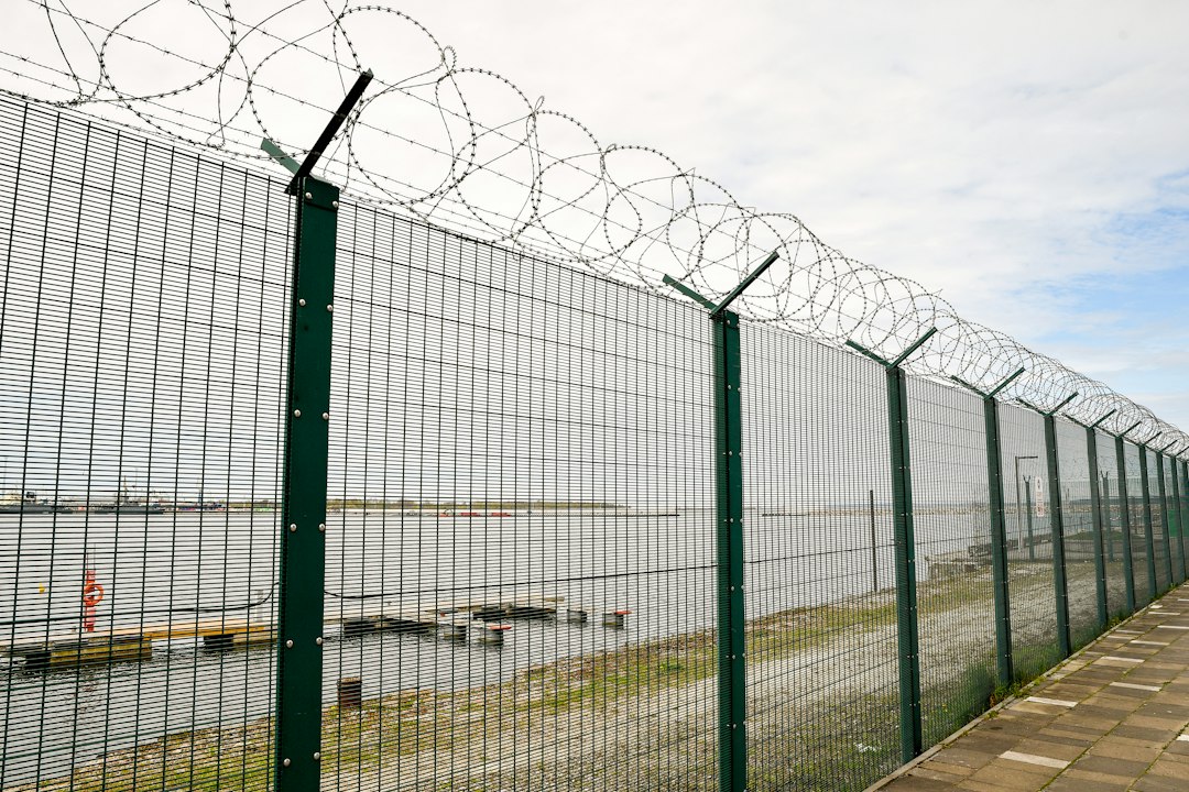 Concertina razor coil installed along high security perimeter fence